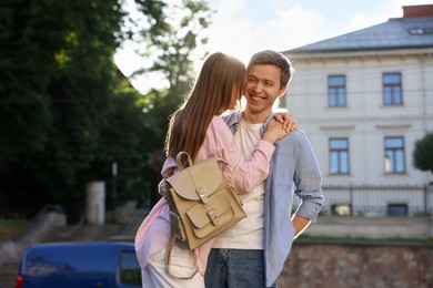 Photo of Lovely couple walking together on city street