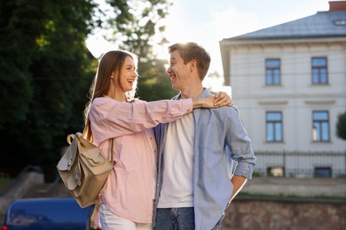 Photo of Lovely couple walking together on city street