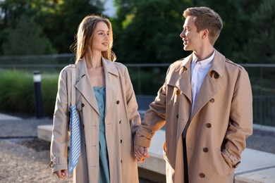 Photo of Lovely couple walking together on city street