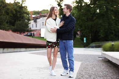 Photo of Lovely couple walking together on city street