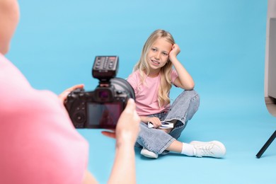 Photo of Photographer working with model in professional photo studio, closeup