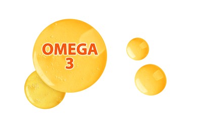 Image of Yellow drops of Omega-3 on white background