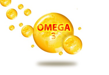 Image of Yellow drops of Omega-3 in air on white background