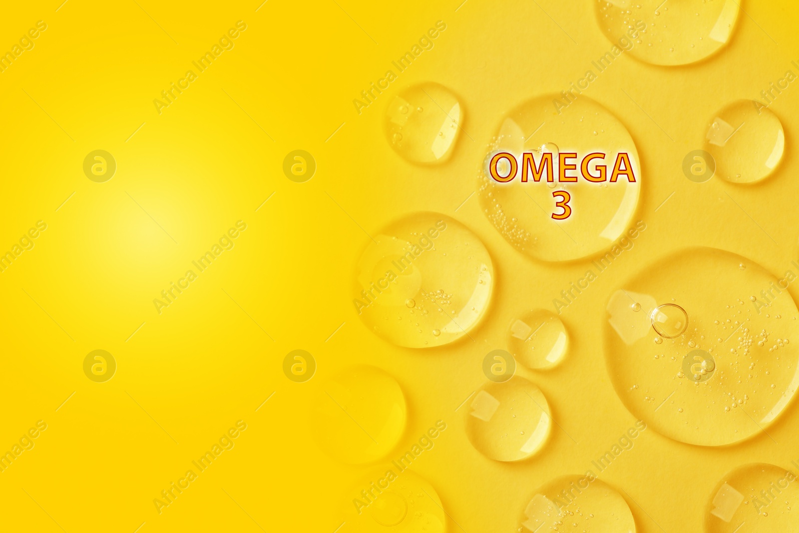 Drops of Omega-3 on yellow gradient background, top view. Space for text Image of Drops of Omega-3 on yellow gradient background, top view. Space for text
