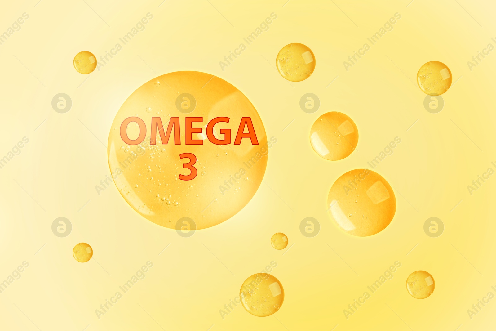 Drops of Omega-3 on yellow gradient background Image of Drops of Omega-3 on yellow gradient background