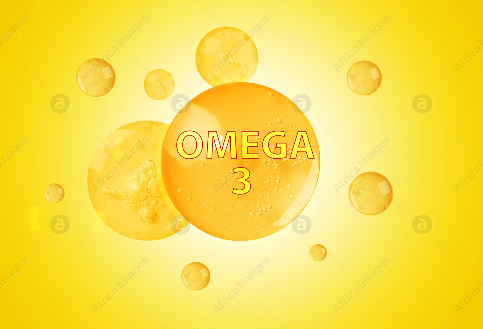 Drops of Omega-3 on yellow gradient background Image of Drops of Omega-3 on yellow gradient background