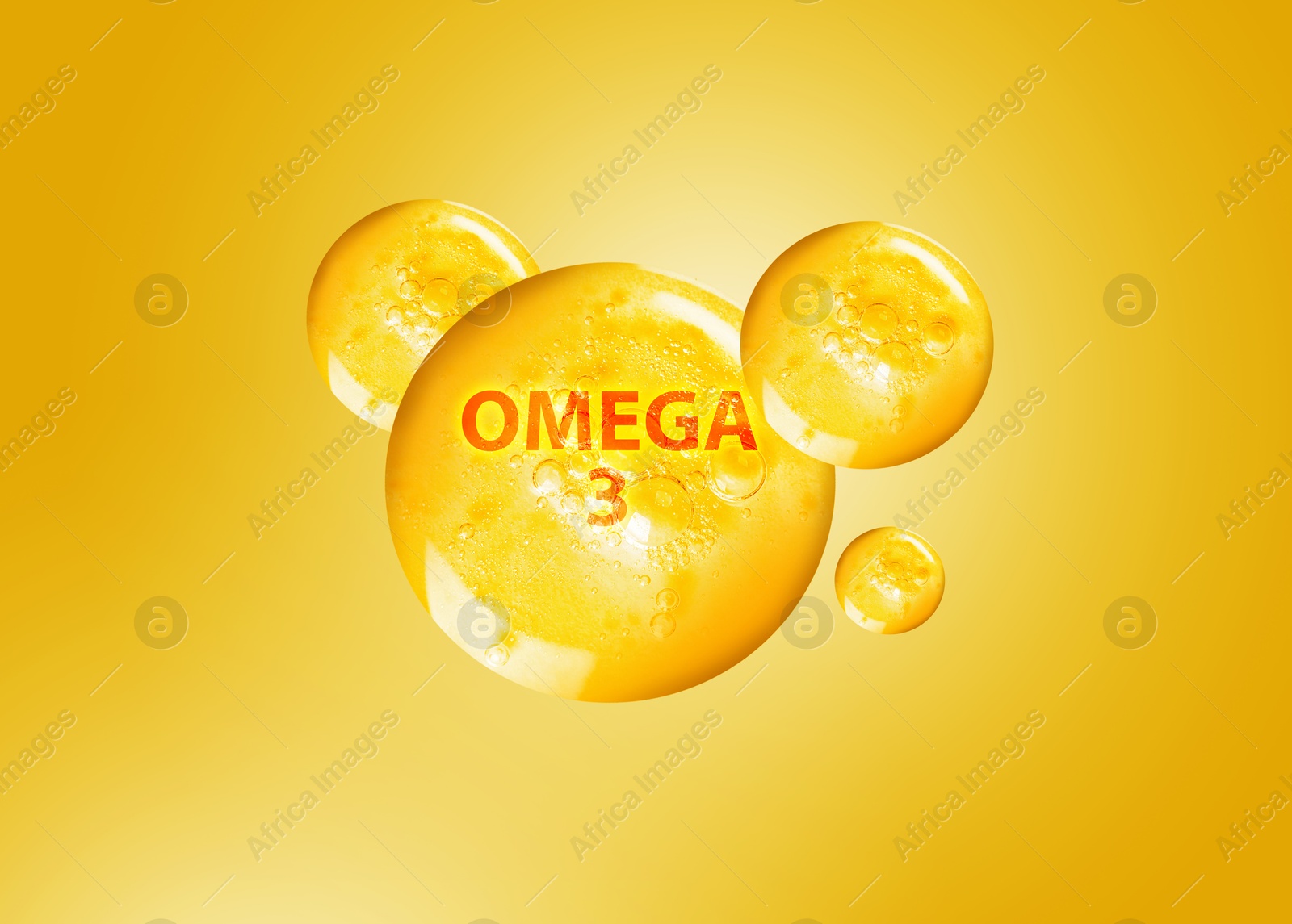Drops of Omega-3 on yellow gradient background Image of Drops of Omega-3 on yellow gradient background