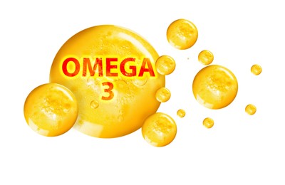 Image of Yellow drops of Omega-3 on white background