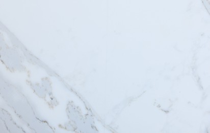 Photo of Texture of white marble surface as background, top view