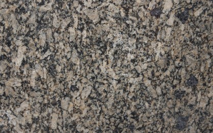Photo of Texture of stone surface as background, top view