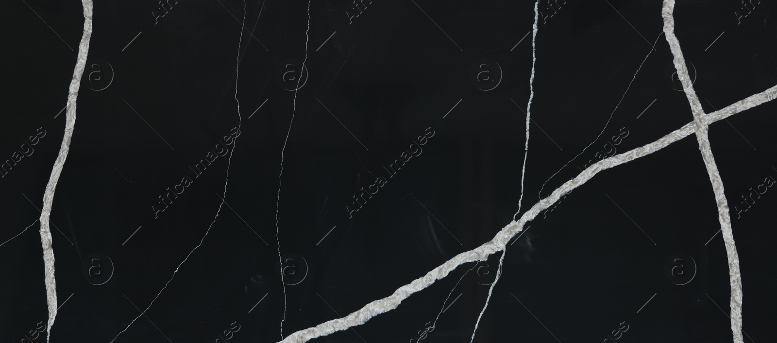 Photo of Texture of black marble surface as background, top view