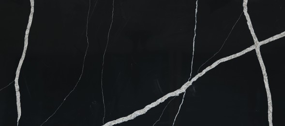 Photo of Texture of black marble surface as background, top view