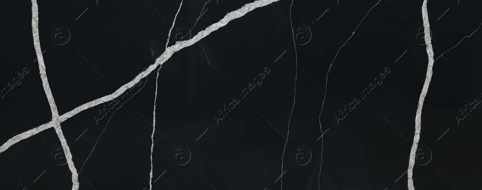 Photo of Texture of black marble surface as background, top view