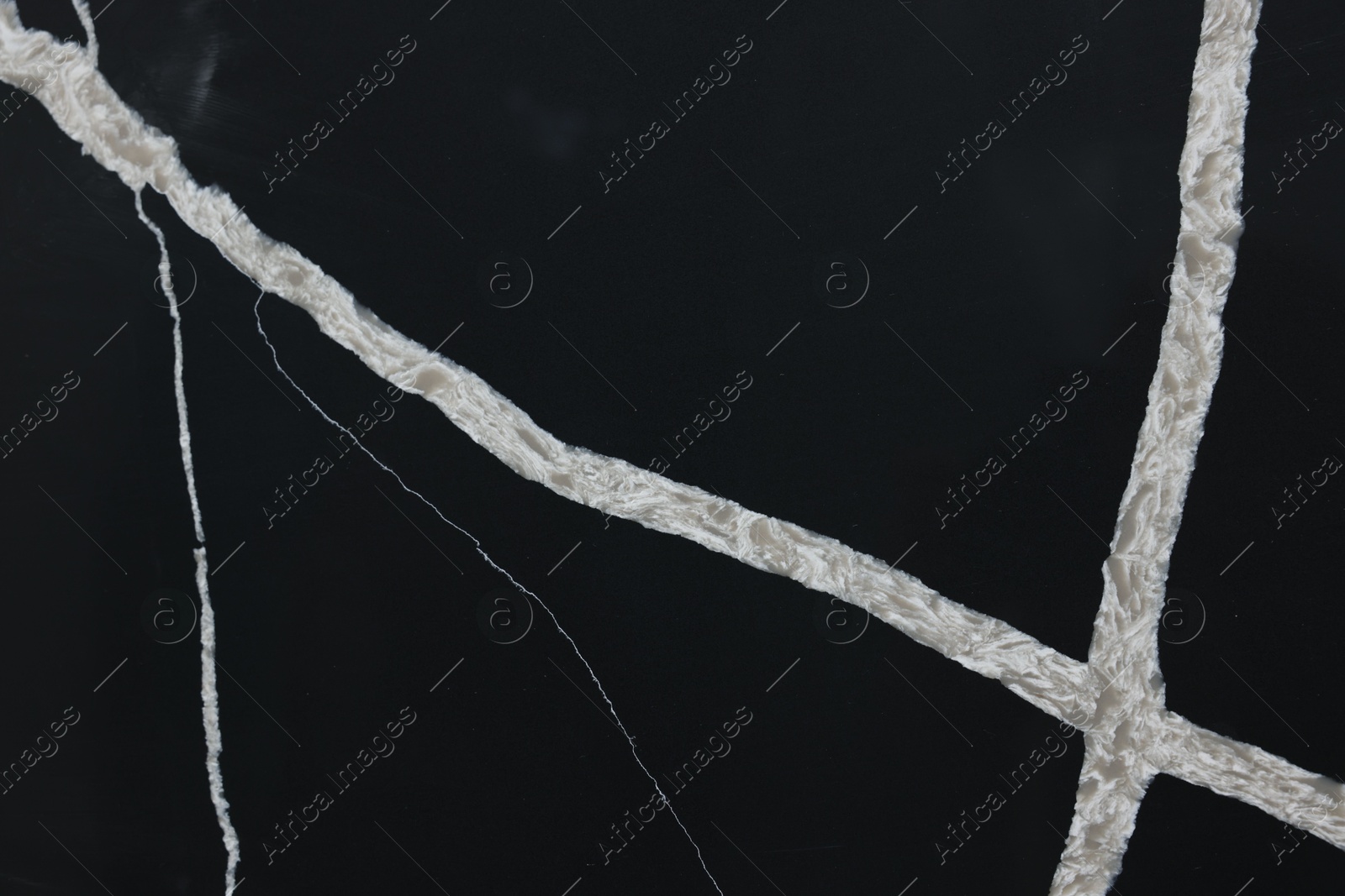 Photo of Texture of black marble surface as background, top view