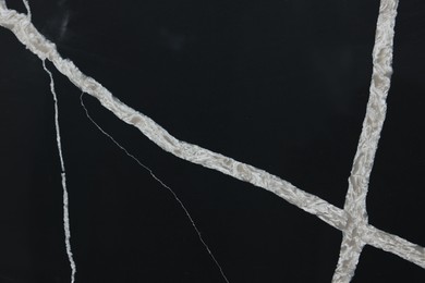 Photo of Texture of black marble surface as background, top view