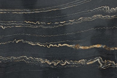 Photo of Texture of dark marble surface as background, top view