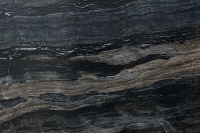 Photo of Texture of dark marble surface as background, top view