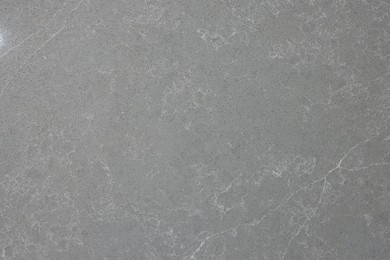 Photo of Texture of grey marble surface as background, top view