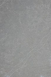 Photo of Texture of grey marble surface as background, top view
