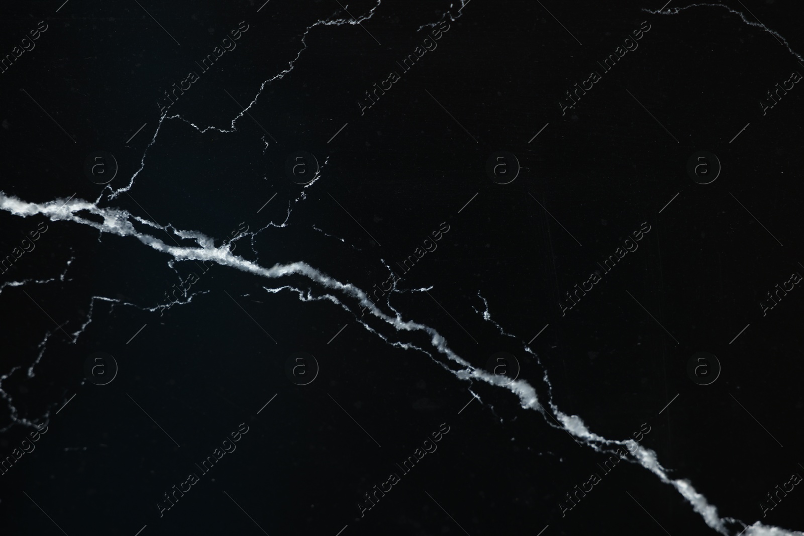 Photo of Texture of black marble surface as background, top view