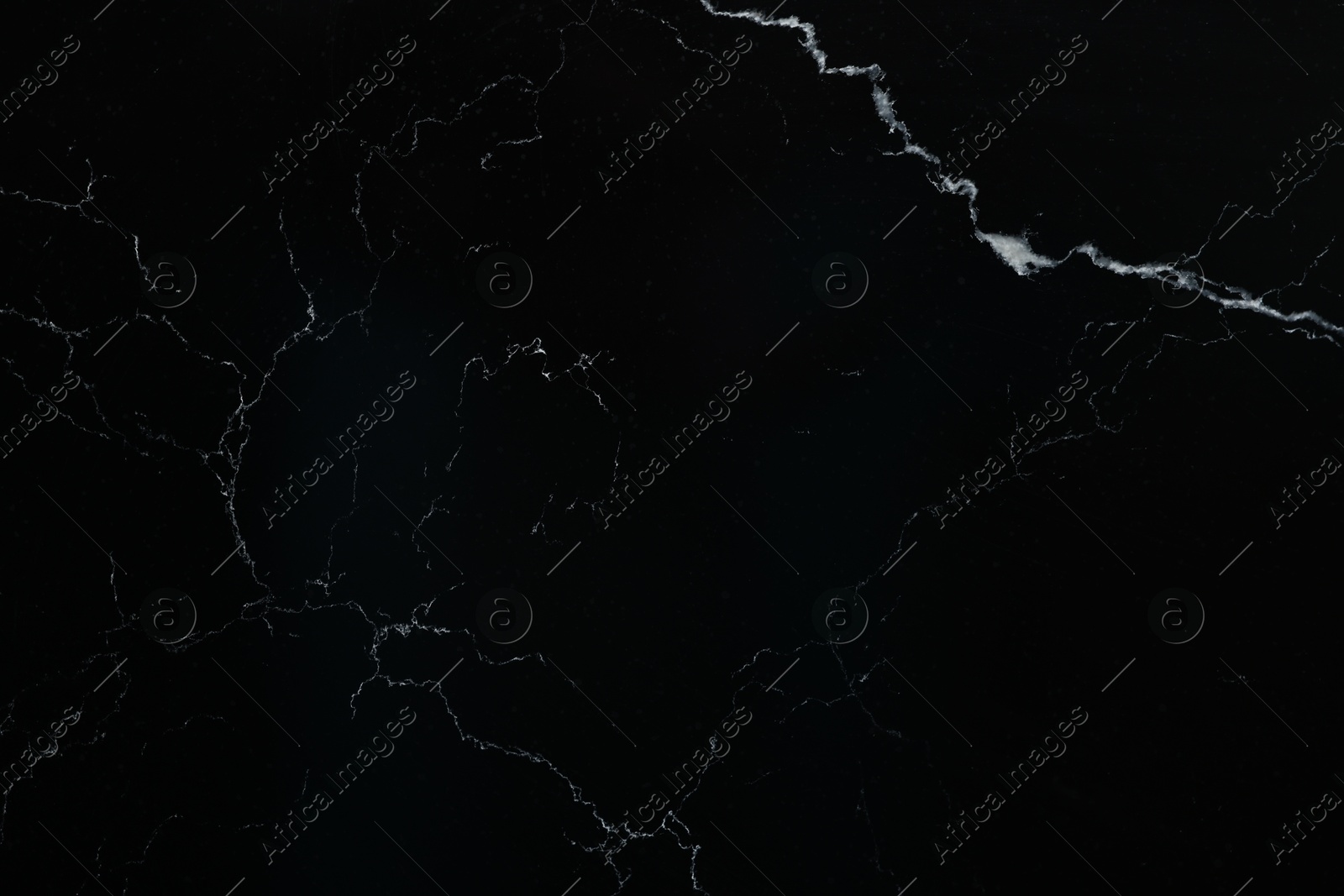 Photo of Texture of black marble surface as background, top view