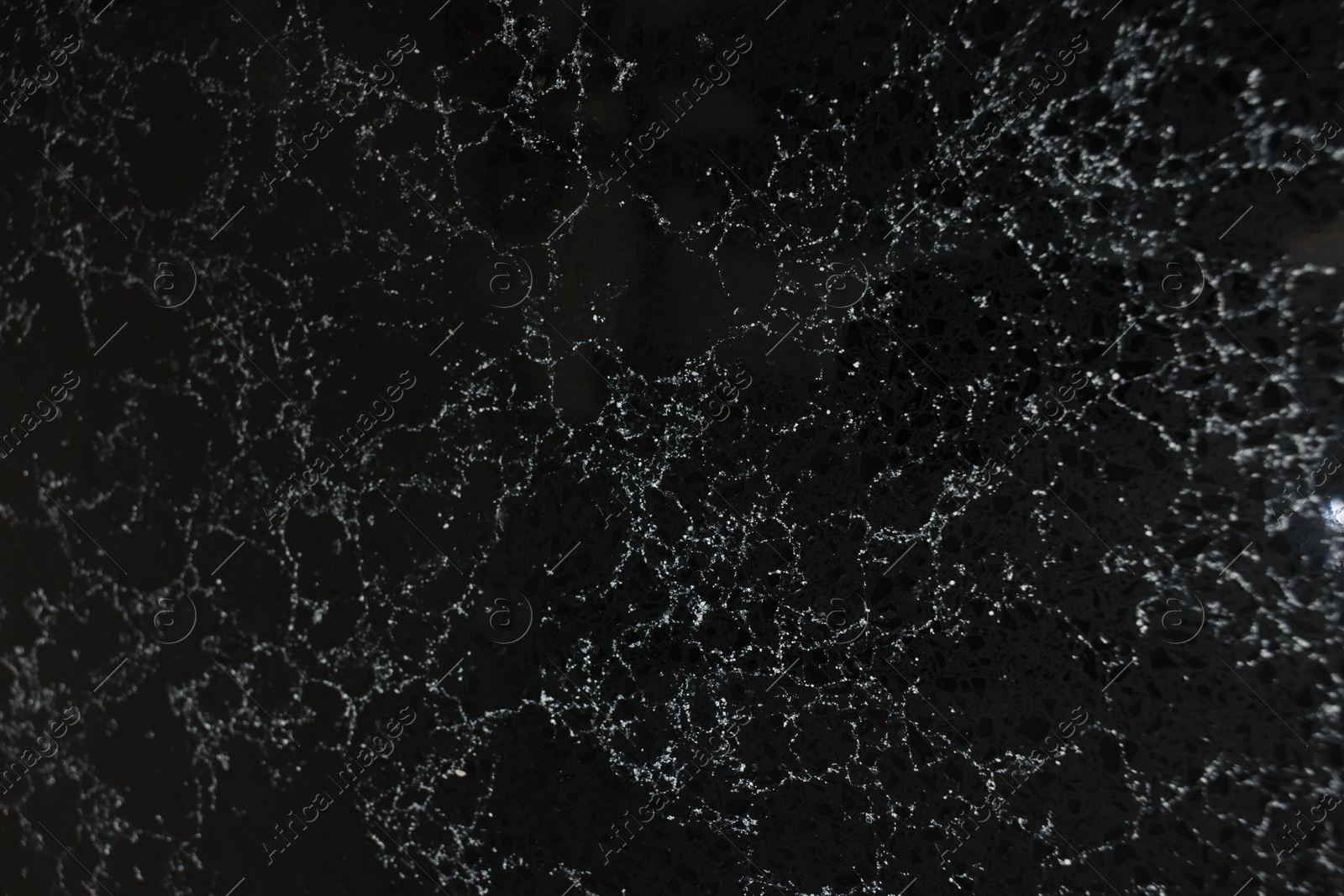 Photo of Texture of black marble surface as background, top view