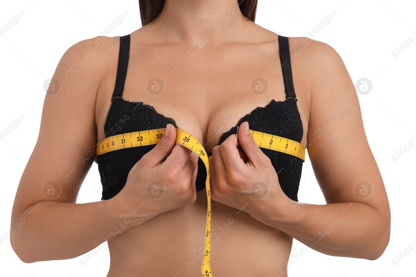 Woman in beautiful bra measuring breast circumference on white background, closeup Photo of Woman in beautiful bra measuring breast circumference on white background, closeup