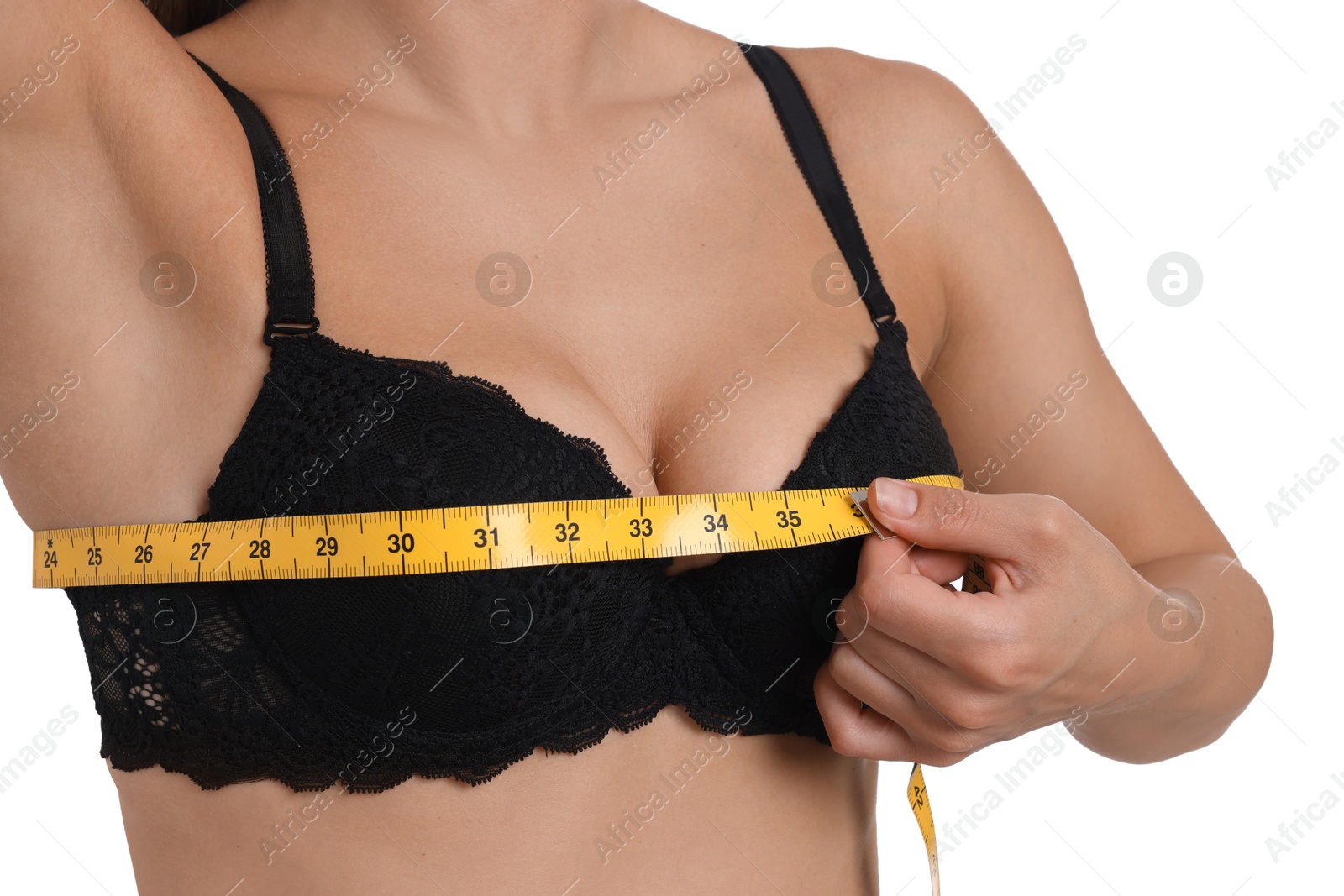 Woman in beautiful bra measuring breast circumference on white background, closeup Photo of Woman in beautiful bra measuring breast circumference on white background, closeup