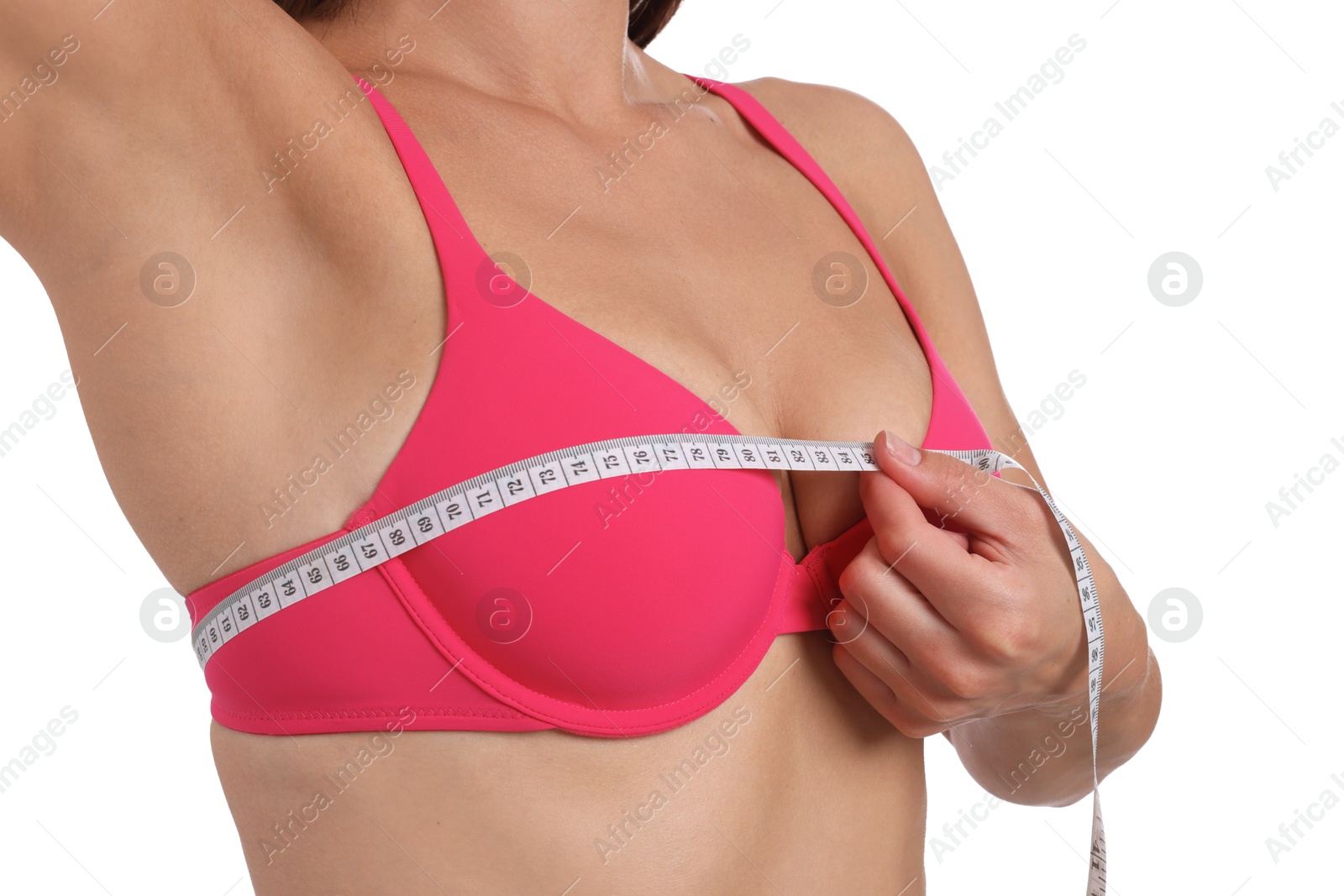 Photo of Woman in beautiful bra measuring breast circumference on white background, closeup
