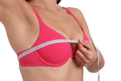 Photo of Woman in beautiful bra measuring breast circumference on white background, closeup