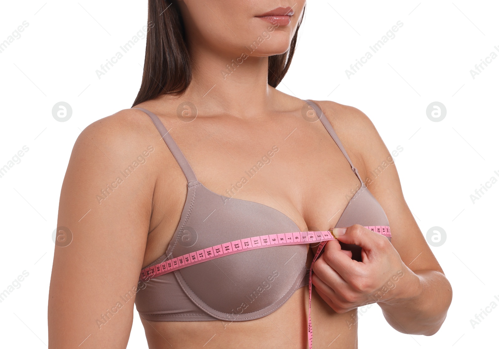 Woman in beautiful bra measuring breast circumference on white background, closeup Photo of Woman in beautiful bra measuring breast circumference on white background, closeup