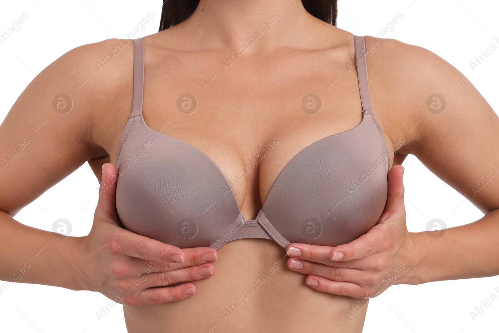 Woman wearing beautiful beige bra on white background, closeup Photo of Woman wearing beautiful beige bra on white background, closeup