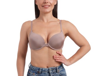 Photo of Woman wearing beautiful beige bra on white background, closeup