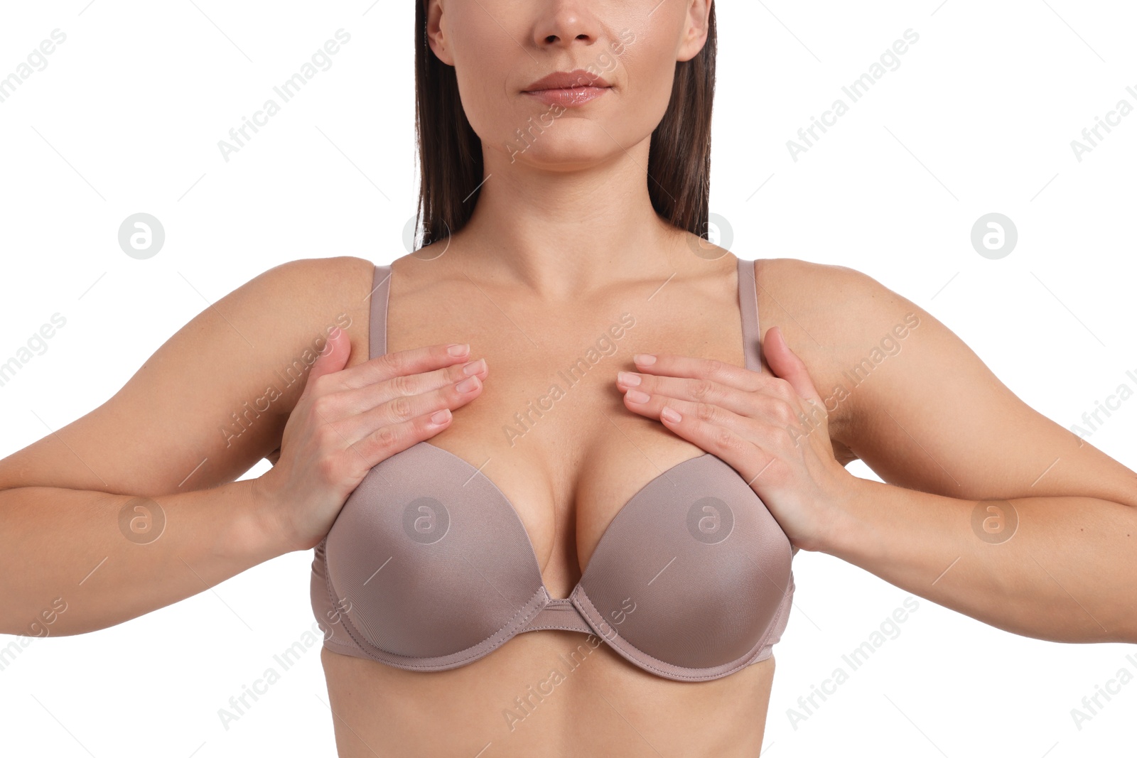 Woman wearing beautiful beige bra on white background, closeup Photo of Woman wearing beautiful beige bra on white background, closeup