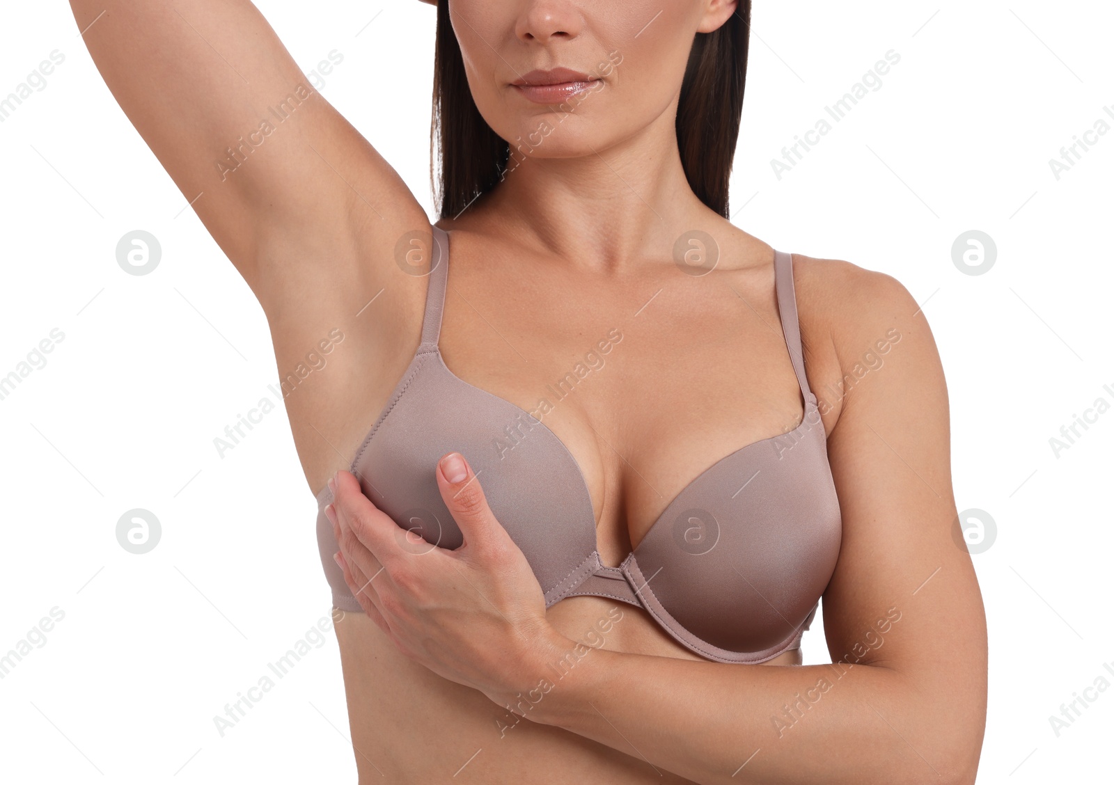 Woman wearing beautiful beige bra on white background, closeup Photo of Woman wearing beautiful beige bra on white background, closeup