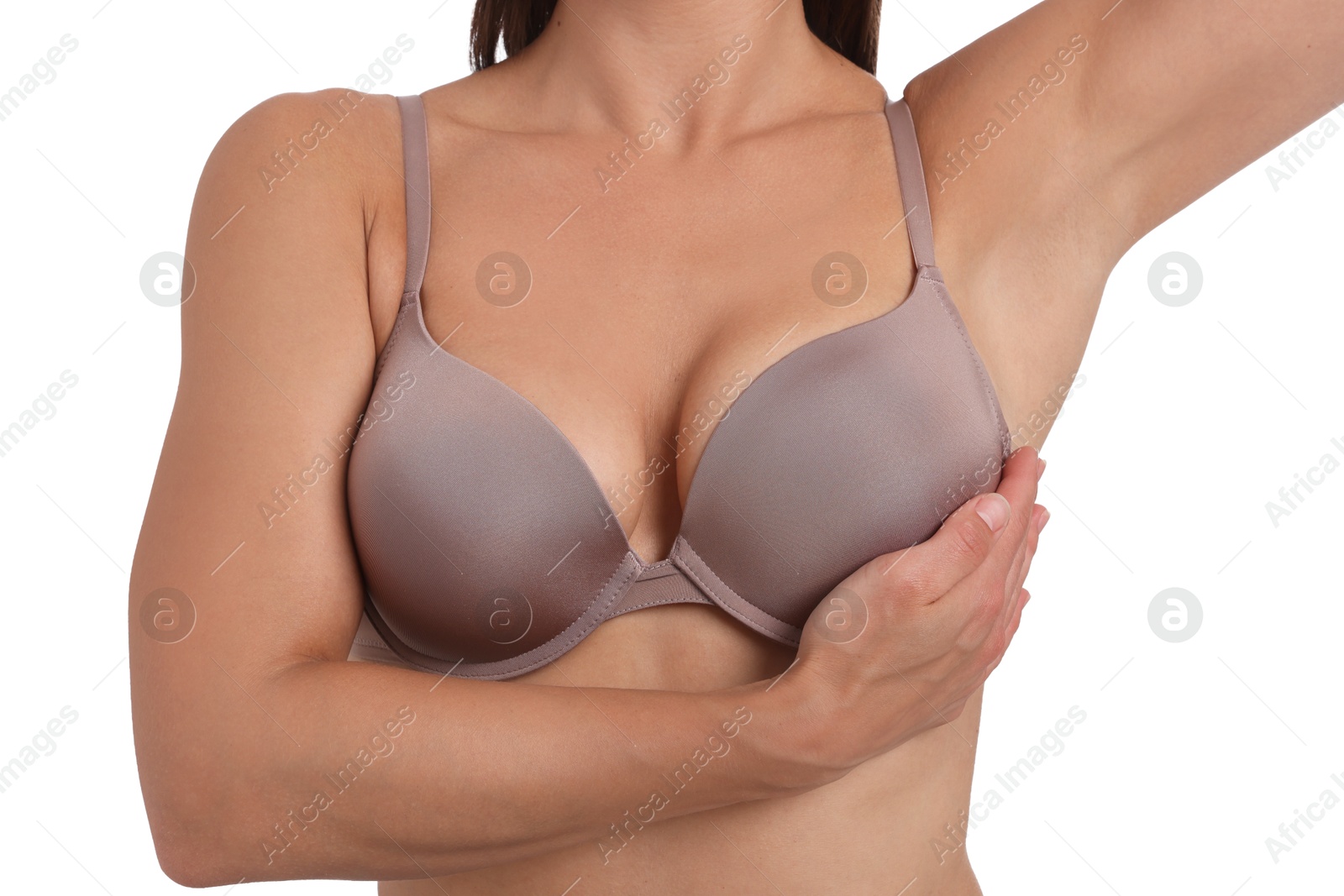 Woman wearing beautiful beige bra on white background, closeup Photo of Woman wearing beautiful beige bra on white background, closeup