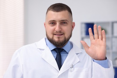 Photo of Portrait of doctor in uniform in clinic