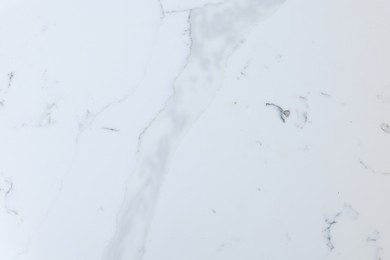 Photo of Texture of white marble surface as background, top view