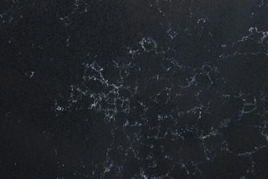 Photo of Texture of black marble surface as background, top view