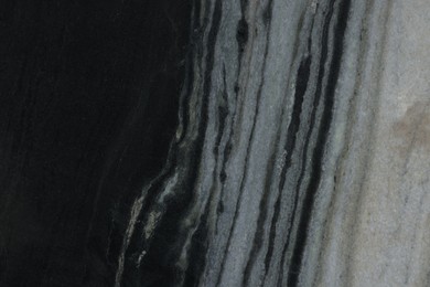 Photo of Texture of black marble surface as background, top view