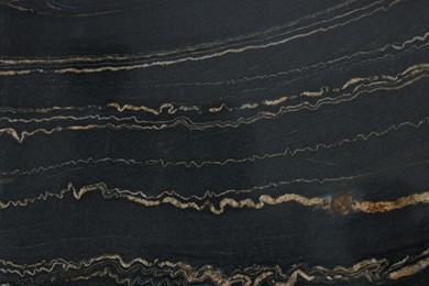 Photo of Texture of dark marble surface as background, top view
