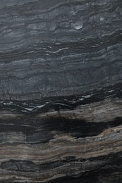 Photo of Texture of dark marble surface as background, top view