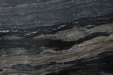 Photo of Texture of dark marble surface as background, top view