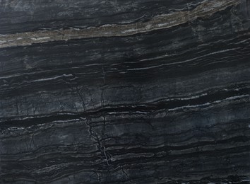 Photo of Texture of dark marble surface as background, top view