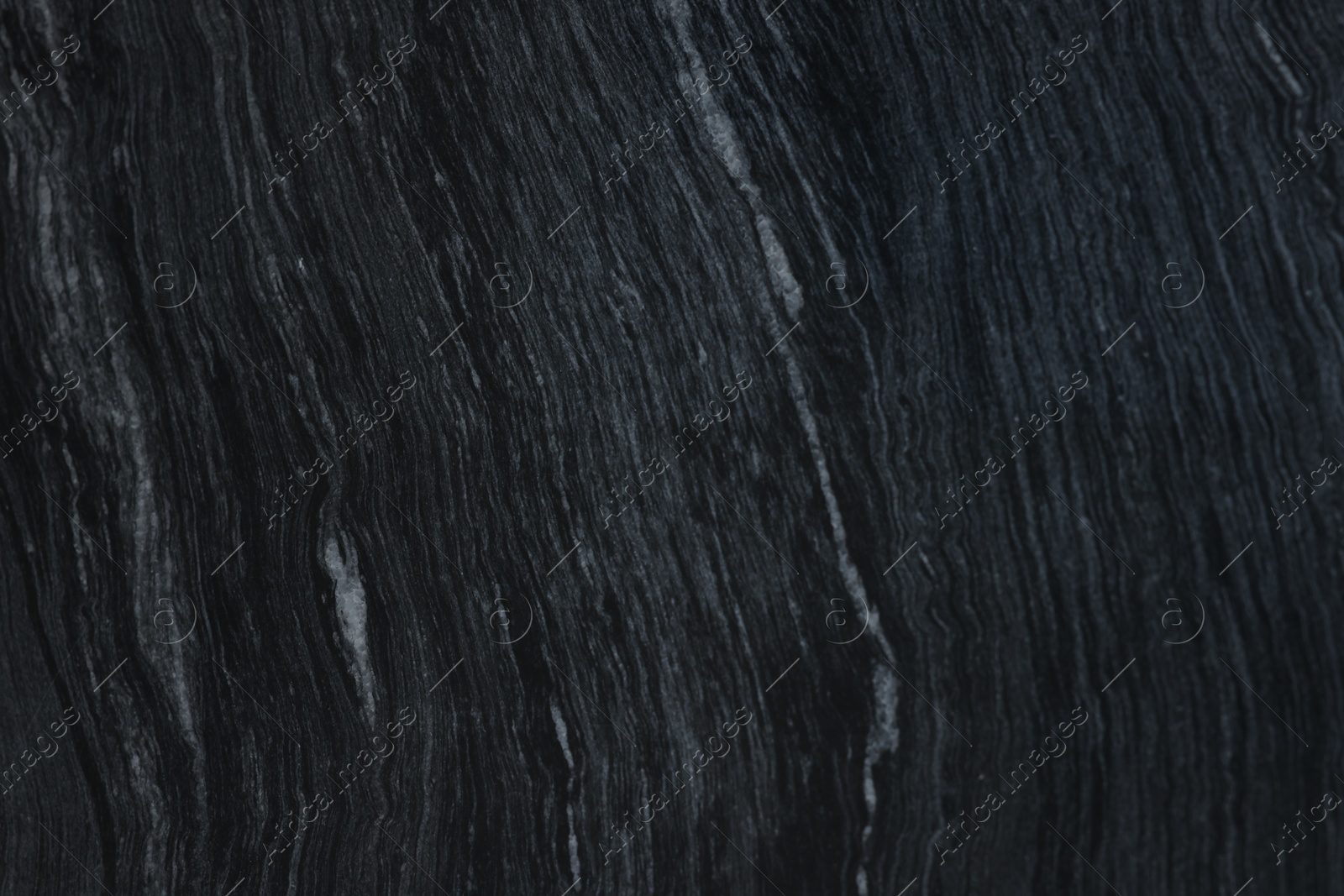 Photo of Texture of dark marble surface as background, top view