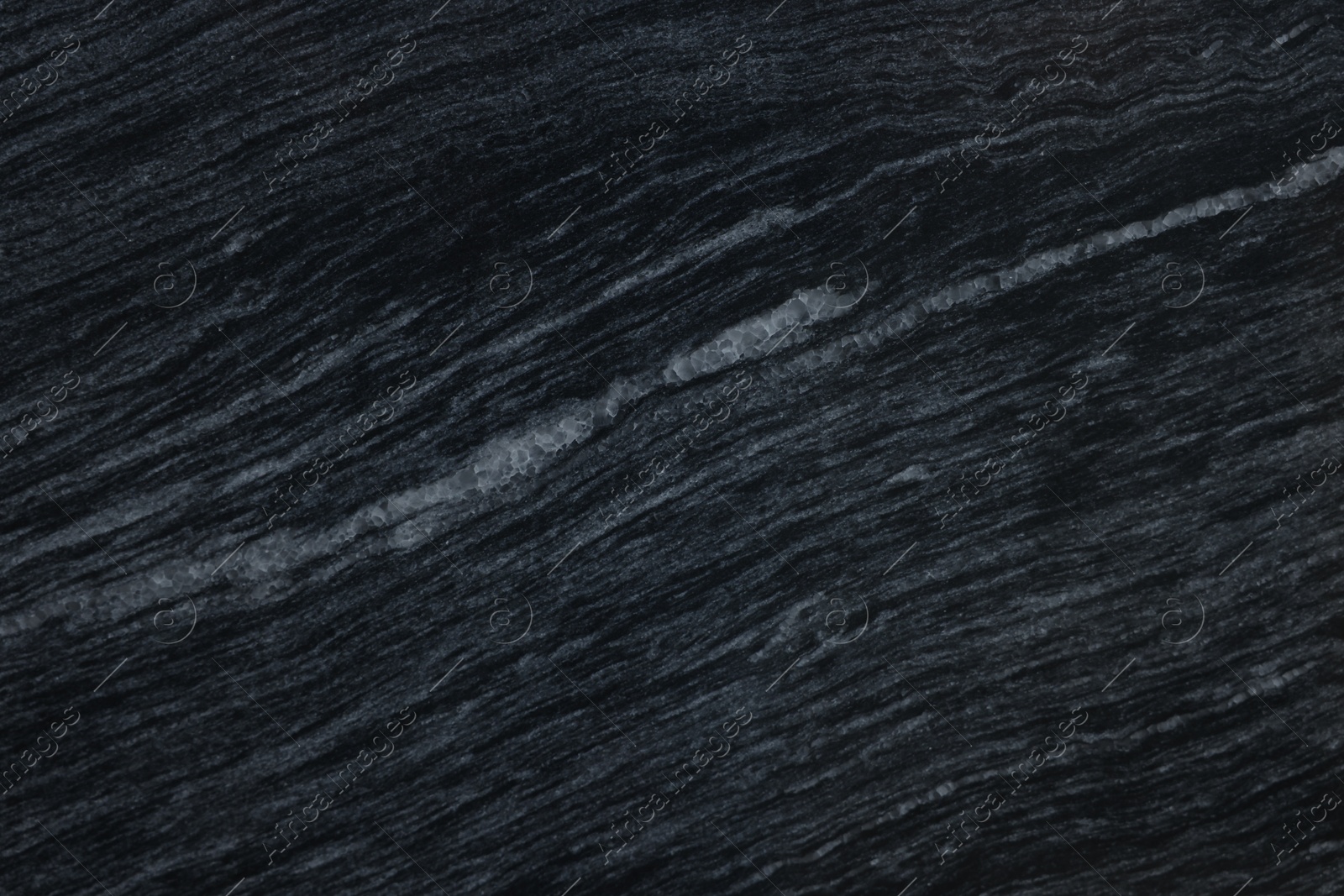 Photo of Texture of dark marble surface as background, top view