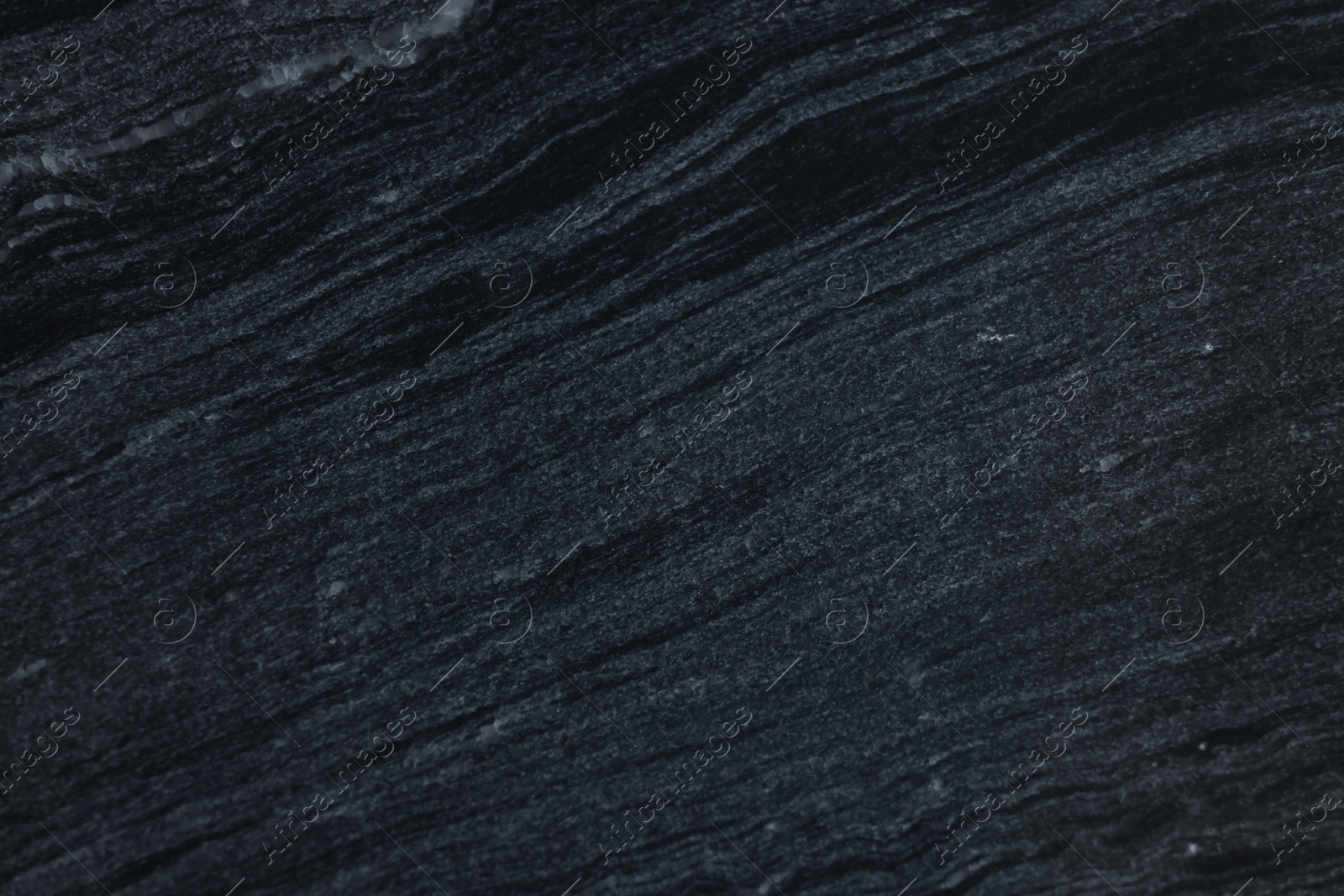 Photo of Texture of dark marble surface as background, top view