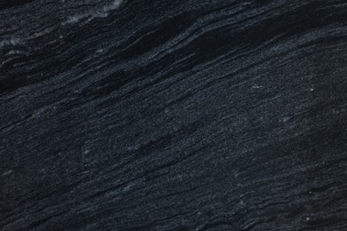 Photo of Texture of dark marble surface as background, top view