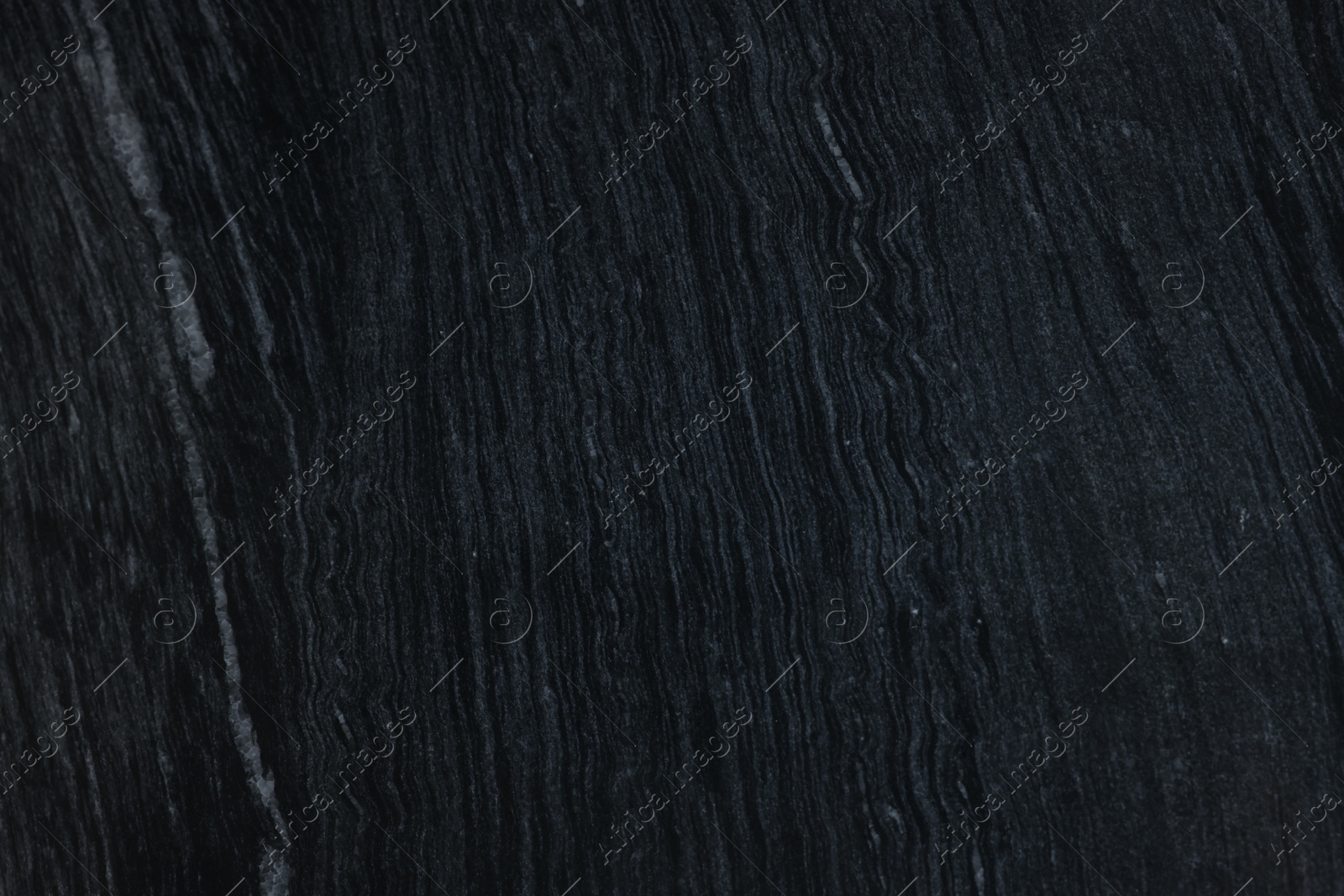 Photo of Texture of dark marble surface as background, top view