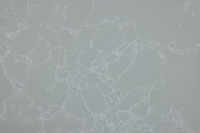 Photo of Texture of grey marble surface as background, top view